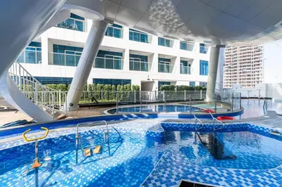 a large swimming pool on a cruise ship at Luxury Dubai Studio with Private Pool & Desert Views in Dubai