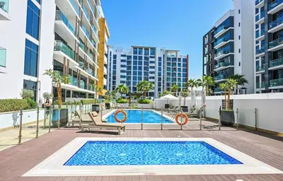 a swimming pool in the middle of a building at Dubai aziIzi in Dubai