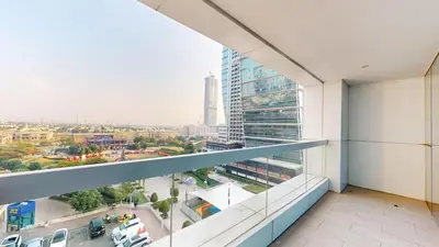 a view of a city from the balcony of a building at 2 bedroom JLT with park view in Dubai