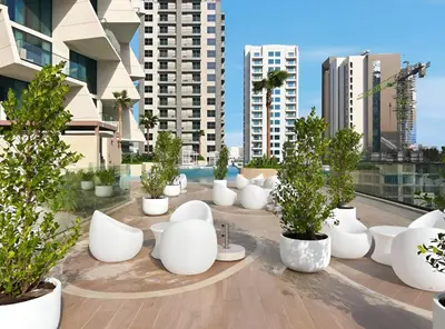 a group of white pots sitting on top of a building at New 1BR with Private Pool Near Circle Mall in Dubai