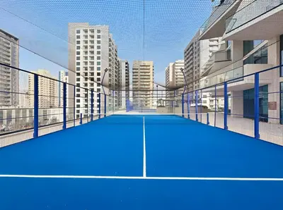 a tennis court in the middle of a city at Stylish 1BR with Private Pool Near Circle Mall in Dubai
