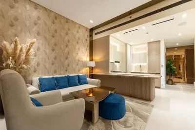a living room with a couch and chairs and a table at Royale Family Apartment 281 with Plunge Pool in Dubai