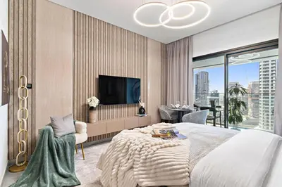 a bedroom with a large bed and a large window at The Smart Concierge - Peninsula One in Dubai