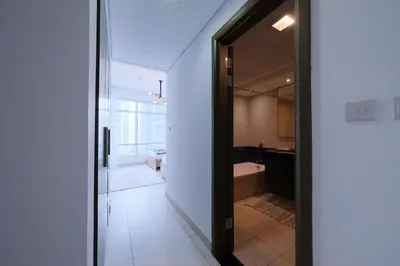 an open door to a bathroom with a tub at Premium Burj Khalifa View Downtown Dubai in Dubai