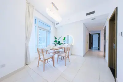 a dining room with a table and chairs at Premium Burj Khalifa View Downtown Dubai in Dubai