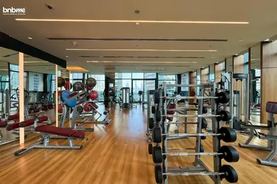 a gym with lots of treadmills and machines at bnbmehomes - Burj Vista Tower 1 in Dubai