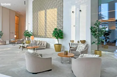 a lobby with couches and chairs and tables at bnbmehomes - Burj Vista Tower 1 in Dubai