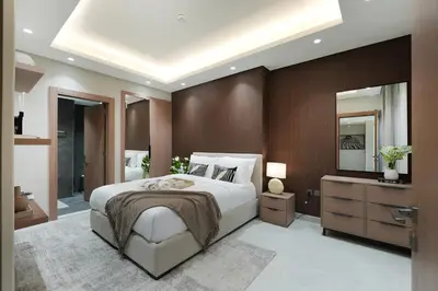 a bedroom with a large bed and a large mirror at Modern 1BR Escape with Balcony View in Dubai