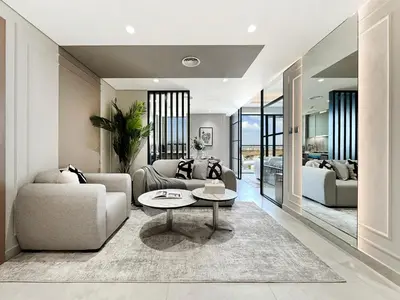 a living room with a couch and a table at Modern 1BR Escape with Balcony View in Dubai