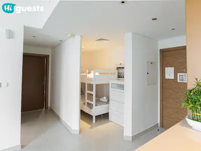 a room with white walls and a closet at HiGuests - Family Friendly 1BR Near Burj Khalifa in Dubai
