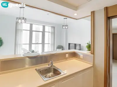 a kitchen with a sink and a window at HiGuests - Family Friendly 1BR Near Burj Khalifa in Dubai