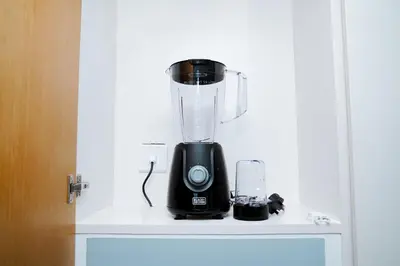 a blender sitting on top of a shelf at Luxury 1BR Apartment near Burj Khalifa & Dubai Mall in Dubai