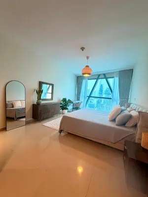 a large bedroom with a large bed and a mirror at Panoramic Luxury 1BR at Park Towers, DIFC, Dubai, Stunning City View in Dubai