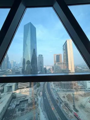 a view of a city skyline from an office window at Panoramic Luxury 1BR at Park Towers, DIFC, Dubai, Stunning City View in Dubai