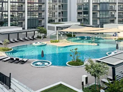 an overhead view of a swimming pool in a building at Luxury 1BR in Sobha Crest City Views & Amenities in Dubai