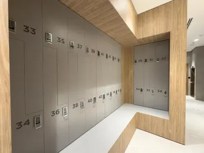 a locker room with a row of lockers at Vogue Business Bay Royal Regency near Downtown, Burj Khalifa and Dubai Mall, One Bedroom Apartment with Balcony and partial Burj Khalifa view, Access to all Amenities in Dubai