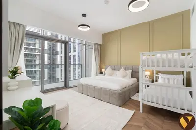 a bedroom with a bed and a couch at Vogue Business Bay Royal Regency near Downtown, Burj Khalifa and Dubai Mall, One Bedroom Apartment with Balcony and partial Burj Khalifa view, Access to all Amenities in Dubai