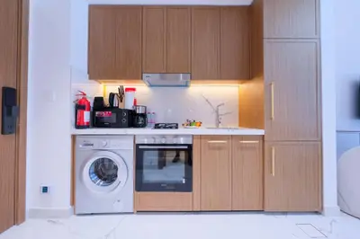 a kitchen with a dishwasher and a washer at Modern Studio Azizi Riviera 59 Al Merkadh Community in Dubai