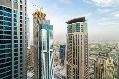 a group of tall buildings in a city at CitiHome - Iconic 1BR Jumeirah Living Marina Gate in Dubai