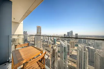 a balcony with a bench and a view of a city at VayK -Downtown Dubai Chic 1BR Retreat in Dubai
