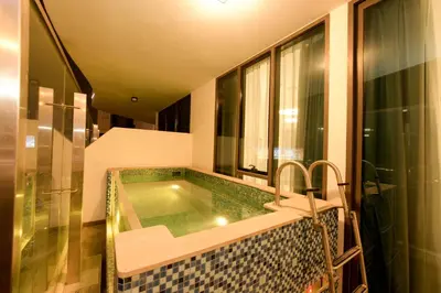 a bathroom with a jacuzzi tub in a building at Luxury 2BR with Private Pool Balcony Arjan in Dubai