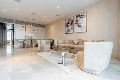 a living room with a couch and a table at Daniels Spacious 3BR with Maid at Five Palm Jumeirah in Dubai