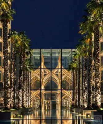 a building with palm trees in front of it at Daniels Spacious 3BR with Maid at Five Palm Jumeirah in Dubai