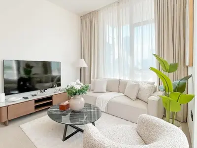 a living room with a couch and a table at Dubai Premium 2BR with Private Pool and Balcony! in Dubai
