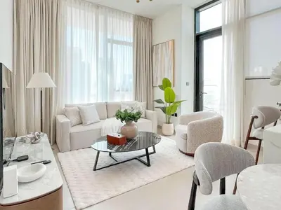 a living room with a couch and chairs and a table at Dubai Premium 2BR with Private Pool and Balcony! in Dubai