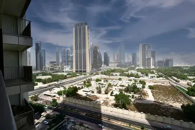a view of a city skyline with tall buildings at Stylish 4BR with Burj View and Dubai Mall Connection in Dubai