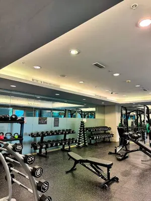 a gym with rows of benches and a christmas tree at Urban Core - Downtown Dubai in Dubai