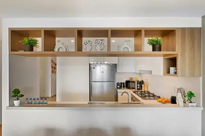 a kitchen with a stainless steel refrigerator at 3bd apartment in downtown dubai in Dubai