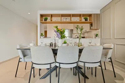 a dining room with a table and chairs at 3bd apartment in downtown dubai in Dubai