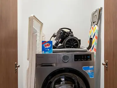 a washing machine with a camera on top of it at Burj Royale 1BD Apartment 5mins walk to Dubai Mall and Burj Khalifa in Dubai