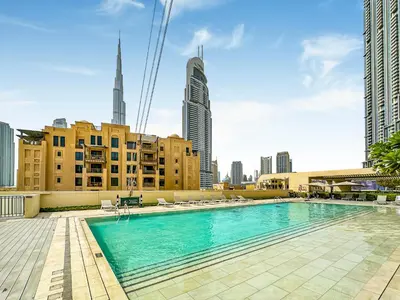 a swimming pool on the roof of a building with buildings at Burj Royale 1BD Apartment 5mins walk to Dubai Mall and Burj Khalifa in Dubai