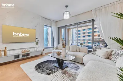 a living room with a couch and a table at bnbmehomes - 29 Boulevard Tower 1 in Dubai