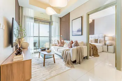 a living room with a couch and a tv at Minutes from Downtown Dubai and Burj Khalifa, Easy Metro Access, Seamless Connectivity to Marina and Palm Jumeirah - Aykon City 2 Tower C, Business Bay by Deluxe Holiday Homes in Dubai