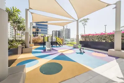 a rendering of a playground on the roof of a building at Cozy 1BR, Easy Access to Dubai Mall - Azizi Riviera 36 by Deluxe Holiday Homes in Dubai