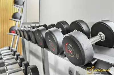 a row of dumbbells on a rack in a gym at Luxury 2BR Dubai Hills Near Mall By Deleguest in Dubai