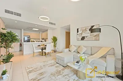 a living room with a couch and a table at Luxury 2BR Dubai Hills Near Mall By Deleguest in Dubai