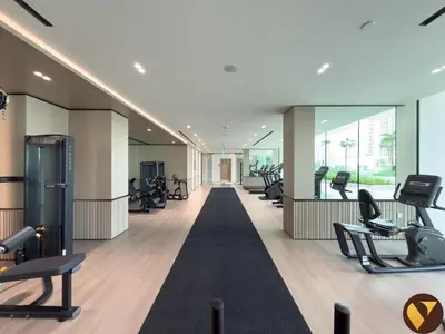 a gym with treadmills and exercise equipment in a building at Vogue JVC Binghatti Phoenix near Circle Mall, Studio Apartment with Balcony and Access to all Amenities in Dubai