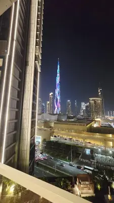 a view of a city at night with a building at Skyline Vida Dubai Mall 3 Bedroom Apartment I Burj Khalifa Views I Direct Access Dubai Mall I Parking, Gym, Wi-Fi & Pool in Dubai