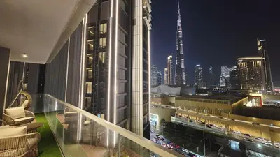 a view of a city at night from a building at Skyline Vida Dubai Mall 3 Bedroom Apartment I Burj Khalifa Views I Direct Access Dubai Mall I Parking, Gym, Wi-Fi & Pool in Dubai