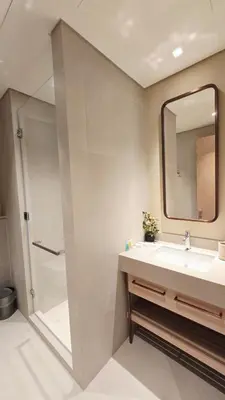a bathroom with a sink and a mirror at Skyline Vida Dubai Mall 3 Bedroom Apartment I Burj Khalifa Views I Direct Access Dubai Mall I Parking, Gym, Wi-Fi & Pool in Dubai