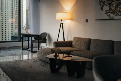 a living room with a couch and a table at Luxury 2BR Huge New Apartment in Dubai