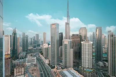 a view of a large city with tall buildings at Luxe 3BR with Infinity Pool and Burj Khalifa View l High Floor in Dubai