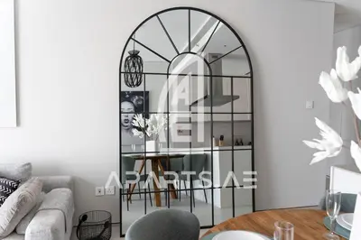 a living room with a glass display case at 2BR Address JBR - Direct Beach Access & Top Views in Dubai