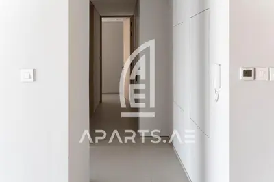a hallway with white walls and a white floor at 2BR Address JBR - Direct Beach Access & Top Views in Dubai