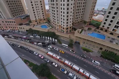 an aerial view of a busy city street with cars at Bright 1BR Marina Promenade Partial Sea View in Dubai
