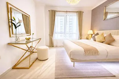 a bedroom with a large bed and a glass table at Elite Royal Apartment - Sky Series - Highest Apartment Floor - Full Burj Khalifa & New Fountain View - Eternal in Dubai